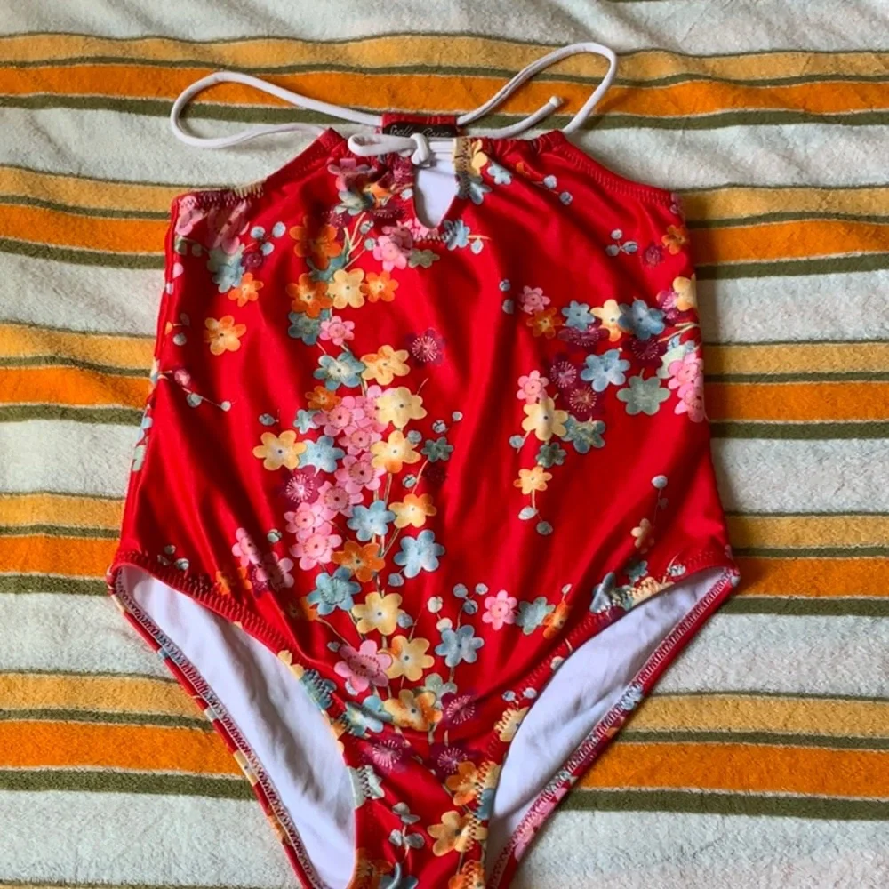 Stella Cove girls Red Floral swimsuit that fits size 7/8